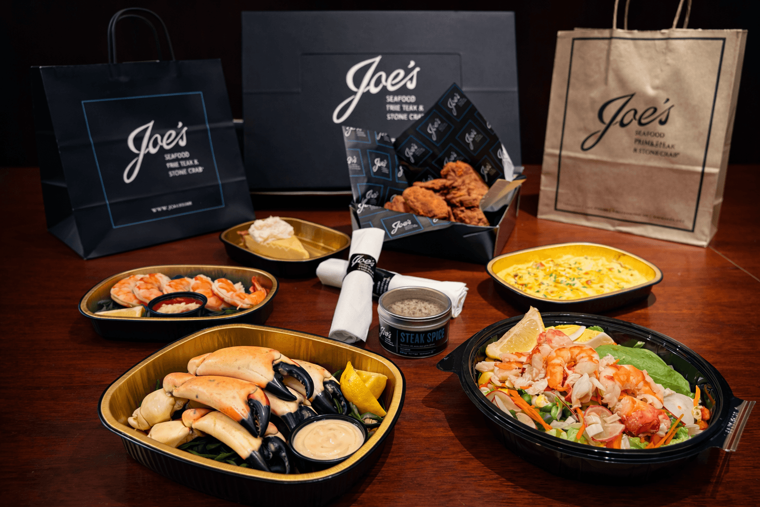 Steak, fried chicken and a variety of other dishes, in to go boxes 
